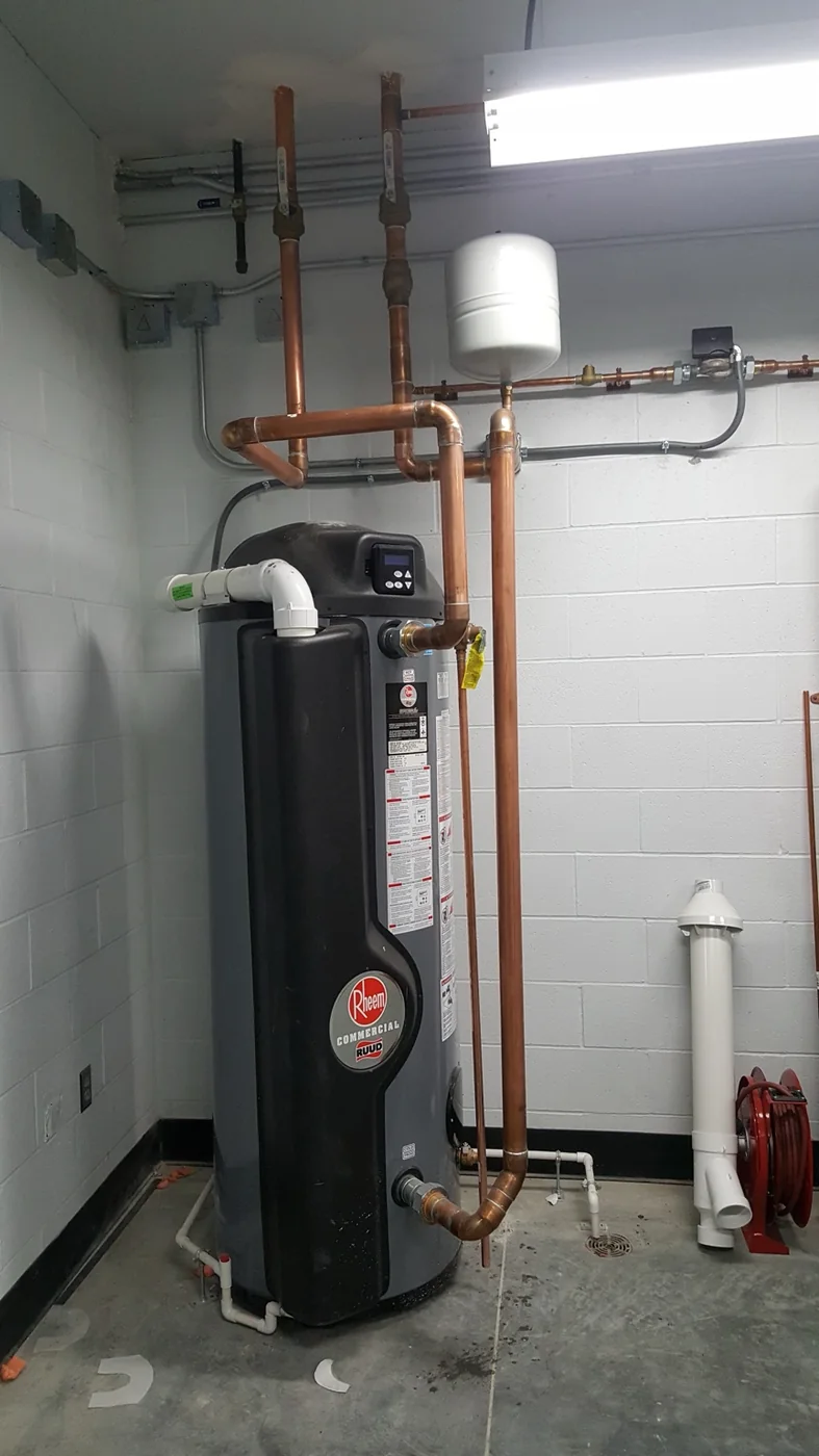 Installed residential water heater and surrounding mechanical connections